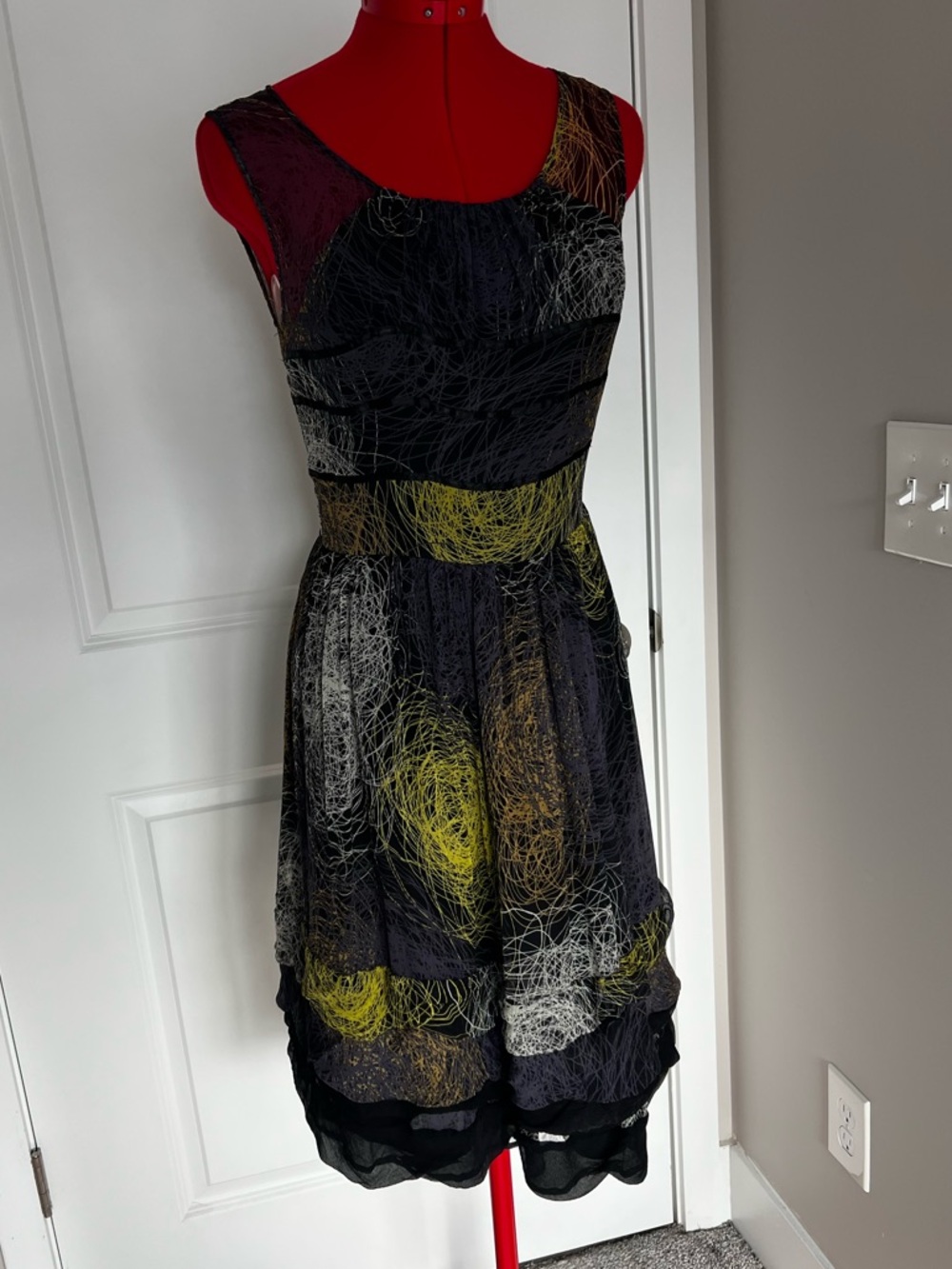 Sleeveless Black Midi Dress with Yellow & Gray Abstract Swirl Print